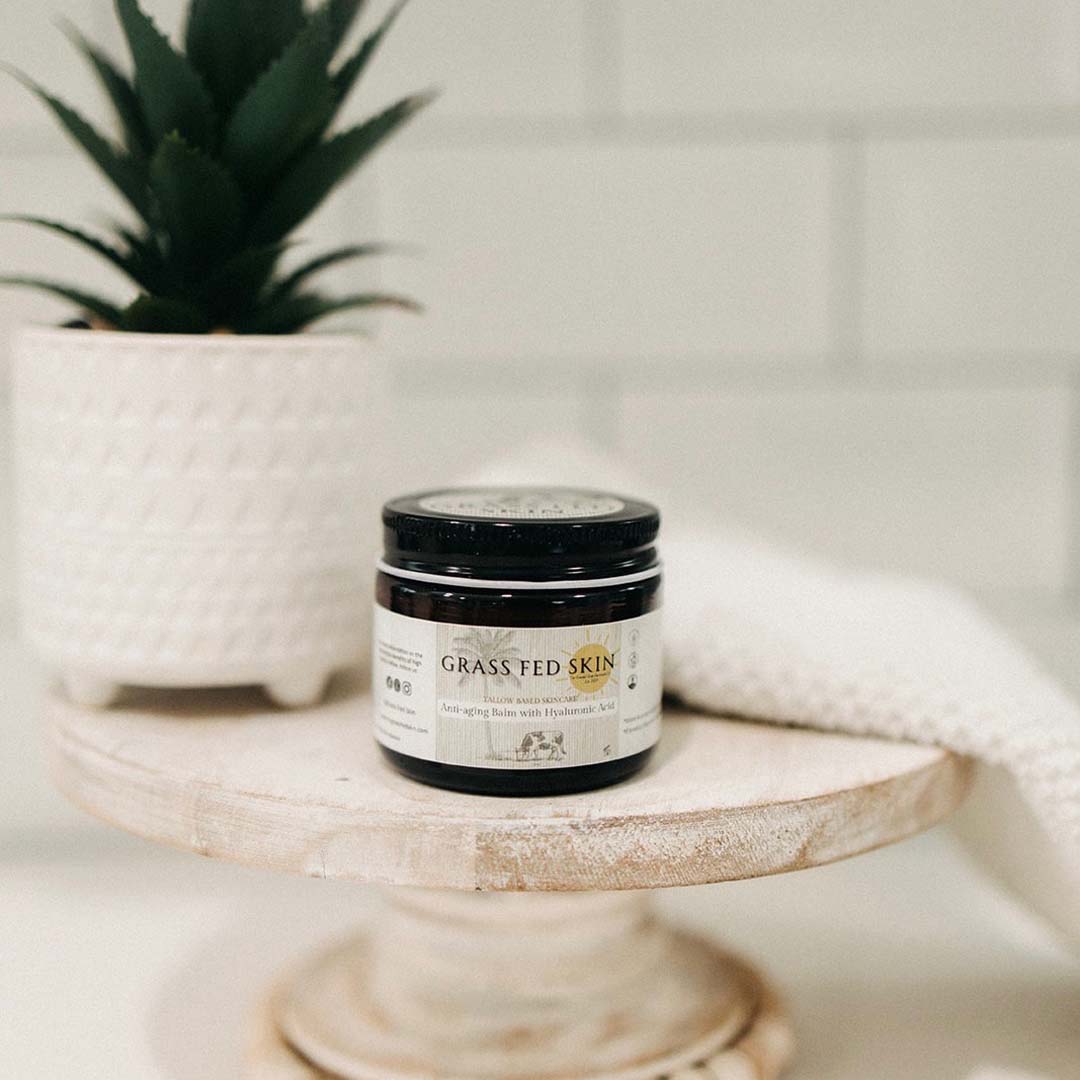 Grass Fed Skin Hyaluronic Acid Anti-Aging Tallow Cream on bathroom table.